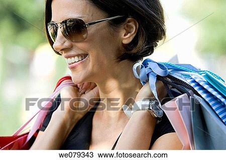 amusement, carry, brunette, bag, addiction View Large Photo Image Stock Image - amusement, carry, brunette, bag, addiction. Fotosearch