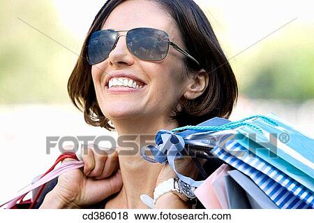 amusement, carry, brunette, bag, addiction View Large Photo Image Stock Photo - amusement, carry, brunette, bag, addiction. Fotosearch