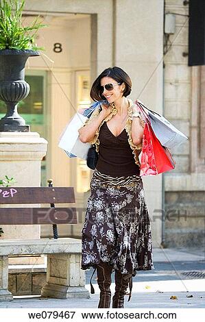 amusement, carry, brunette, bag, addiction View Large Photo Image Stock Photo - amusement, carry, brunette, bag, addiction. Fotosearch