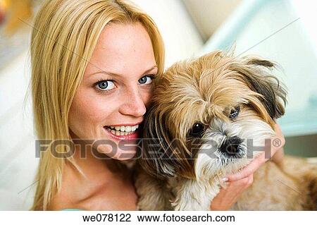 Stock Image - animal, blue eyes, blond, affection. Fotosearch