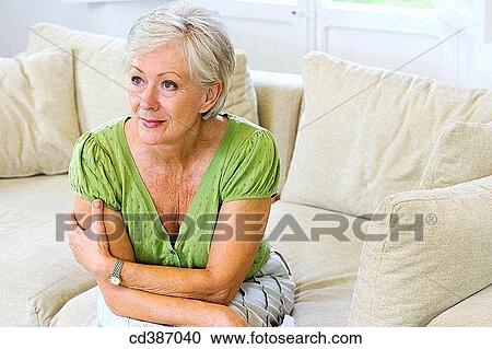 Stock Image - arms folded, attentive, attention, at-home, Arms crossed. Fotosearch