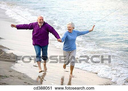 Arms open, beard, beach, barefoot, amusement View Large Photo Image Stock Image - Arms open, beard, beach, barefoot, amusement. Fotosearch