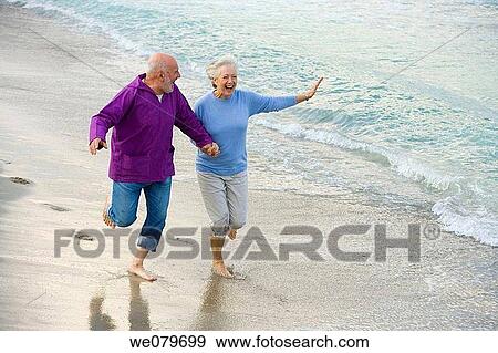 Arms open, beard, beach, barefoot, amusement View Large Photo Image Stock Photo - Arms open, beard, beach, barefoot, amusement. Fotosearch