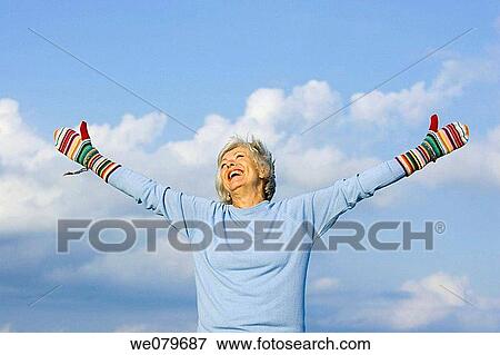 Arms open, carefree, blue, Arms raised, amusing View Large Photo Image Stock Photo - Arms open, carefree, blue, Arms raised, amusing. Fotosearch