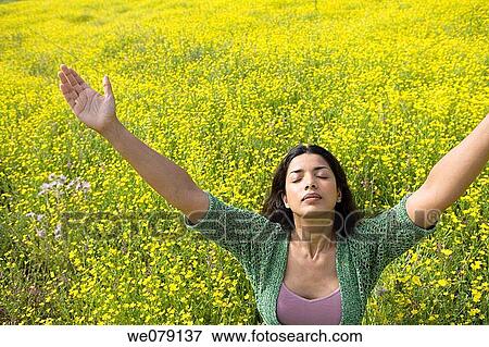 Stock Photo - Arms raised, chilling out, Asian, Arms open. Fotosearch