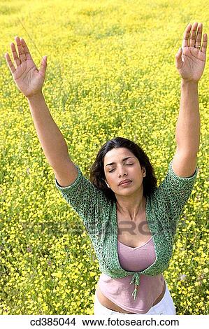 Asian, chilling out, calm, Arms raised View Large Photo Image Picture - Asian, chilling out, calm, Arms raised. Fotosearch