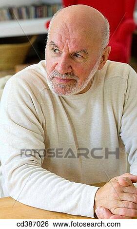 Stock Photograph - at-home, beard, absorbed. Fotosearch