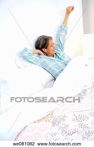at-home, bed, Arms raised View Large Photo Image Stock Image - at-home, bed, Arms raised. Fotosearch
