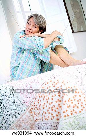at-home, bed, barefoot, absorbed View Large Photo Image Picture - at-home, bed, barefoot, absorbed. Fotosearch