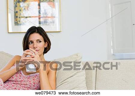 Stock Image - at-home, calm, brunette, absorbed. Fotosearch