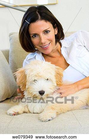 Stock Photo - at-home, calm, brunette, animal. Fotosearch