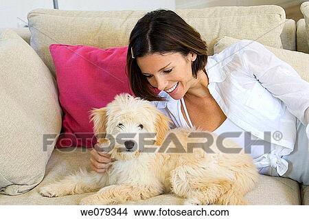 at-home, caressing, caress, brunette, animal View Large Photo Image Picture - at-home, caressing, caress, brunette, animal. Fotosearch