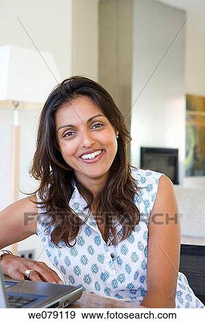 Stock Photo - at-home, contemporary, computer, Asian. Fotosearch