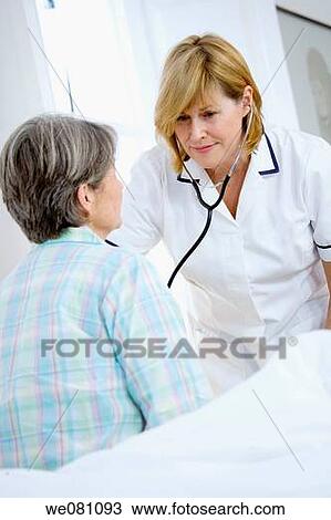 Stock Image - auscultation, clinic, bed, auscultate. Fotosearch