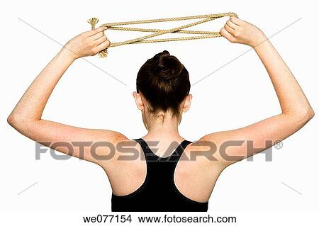 Picture - back view, clipping path, brunette, Arms raised. Fotosearch