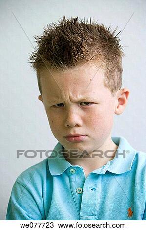 Stock Image - Bad mood, child, boy, angry. Fotosearch