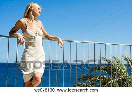 balcony, blond, blue, blue sky View Large Photo Image Stock Image - balcony, blond, blue, blue sky. Fotosearch