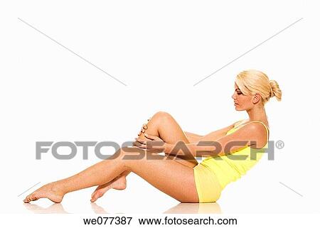 Stock Photo - barefoot, beauty, blond, clipping path. Fotosearch