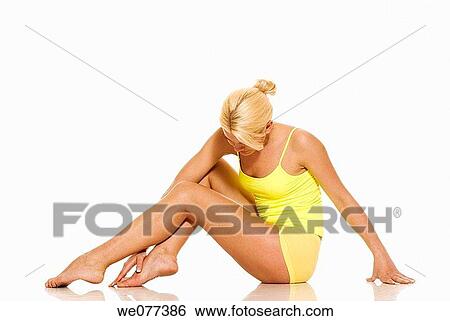 Stock Photograph - barefoot, beauty, blond, clipping path. Fotosearch