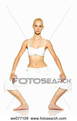 Stock Photo - barefoot, blond, clipping path. Fotosearch