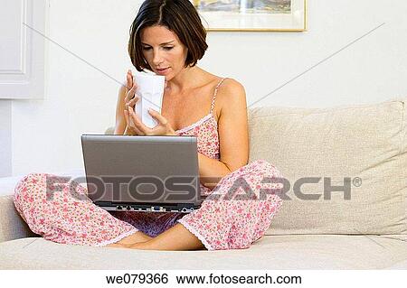 Stock Photograph - barefoot, brunette, at-home. Fotosearch