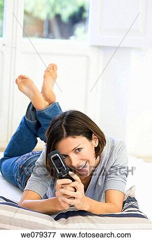 barefoot, camera, brunette, at-home View Large Photo Image Stock Photo - barefoot, camera, brunette, at-home. Fotosearch