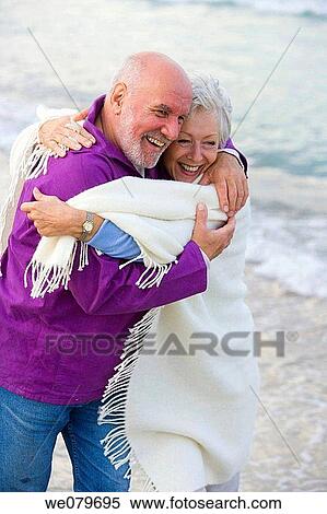 Stock Photography - beach, blanket, beard, affection. Fotosearch