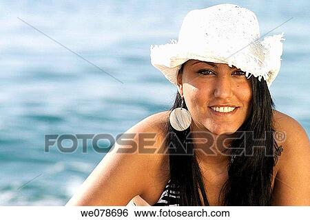 Stock Photograph - beach, contemporary, brunette, accessory. Fotosearch