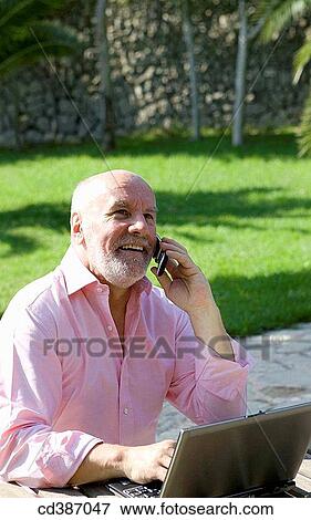 Stock Photo - beard, calling, cell phone. Fotosearch