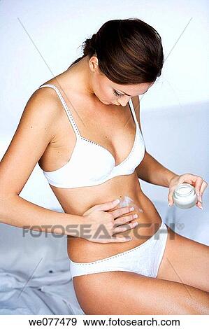 beauty, brunette, Body care, belly, apply View Large Photo Image Stock Photo - beauty, brunette, Body care, belly, apply. Fotosearch