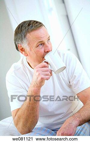 Stock Image - bed, blue eyes, bedroom, at-home. Fotosearch