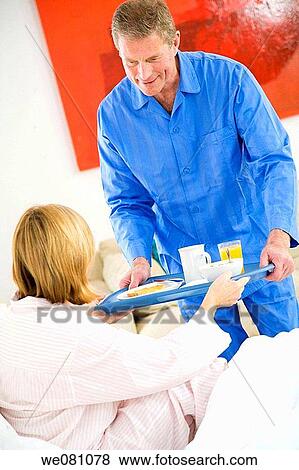 Stock Photo - bed, carrying, carry, breakfast, at-home. Fotosearch