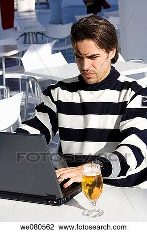 beer, black hair, Cafe terrace View Large Photo Image Stock Image - beer, black hair, Cafe terrace. Fotosearch