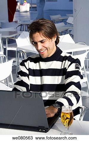 beer, black hair, Cafe terrace View Large Photo Image Stock Image - beer, black hair, Cafe terrace. Fotosearch