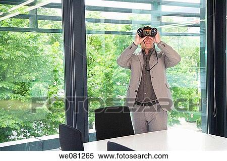 Stock Photography - binocular, black hair, board-room, business. Fotosearch