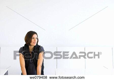 Stock Photo - black, brunette, absorbed. Fotosearch