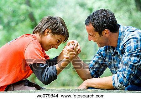 black hair, child, boy, arm wrestling View Large Photo Image Picture - black hair, child, boy, arm wrestling. Fotosearch