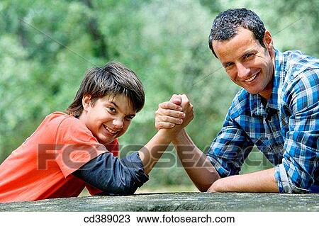 black hair, child, boy, arm wrestling View Large Photo Image Stock Image - black hair, child, boy, arm wrestling. Fotosearch