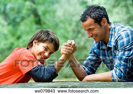 black hair, child, boy, arm wrestling View Large Photo Image Stock Image - black hair, child, boy, arm wrestling. Fotosearch