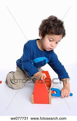 black hair, child, carpenter, boy, amusement View Large Photo Image Stock Image - black hair, child, carpenter, boy, amusement. Fotosearch
