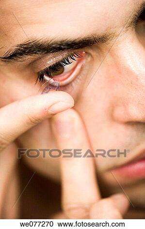 Stock Image - black hair, Close-up, Contact lens. Fotosearch
