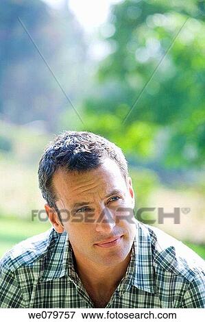 Stock Photo - black hair, contemporary, absorbed. Fotosearch