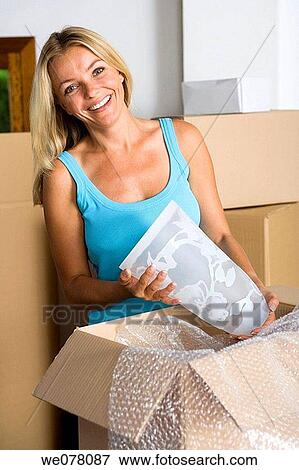 Stock Photo - blond, Bubble Wrap, at-home. Fotosearch