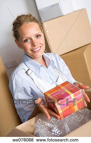 Stock Photo - blond, Bubble Wrap, at-home. Fotosearch