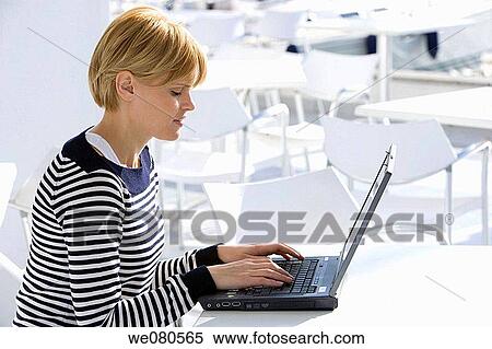 blond, Cafe terrace, computer View Large Photo Image Stock Photography - blond, Cafe terrace, computer. Fotosearch