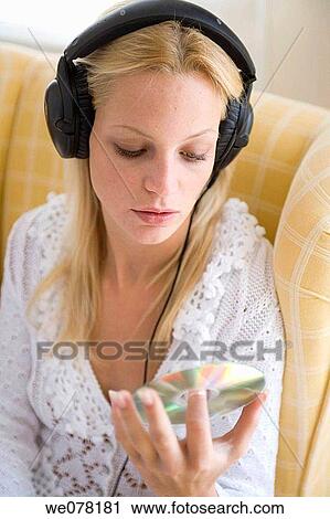 Stock Image - blond, cds, CD, at-home. Fotosearch