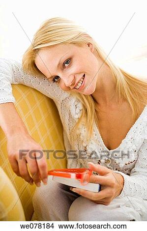 blond, chair, book, at-home View Large Photo Image Picture - blond, chair, book, at-home. Fotosearch