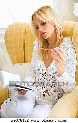 blond, chair, book, at-home View Large Photo Image Stock Image - blond, chair, book, at-home. Fotosearch