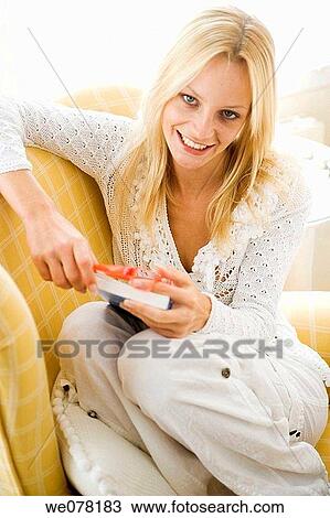blond, chair, book, at-home View Large Photo Image Stock Image - blond, chair, book, at-home. Fotosearch