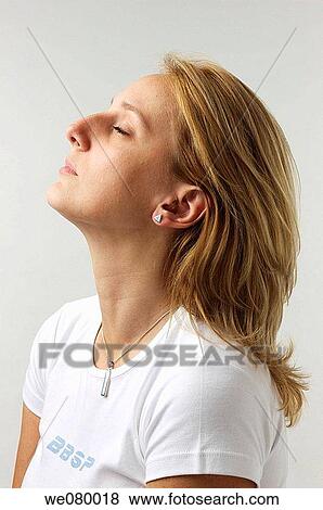 Blond woman looking up View Large Photo Image Stock Photo - Blond woman looking up. Fotosearch